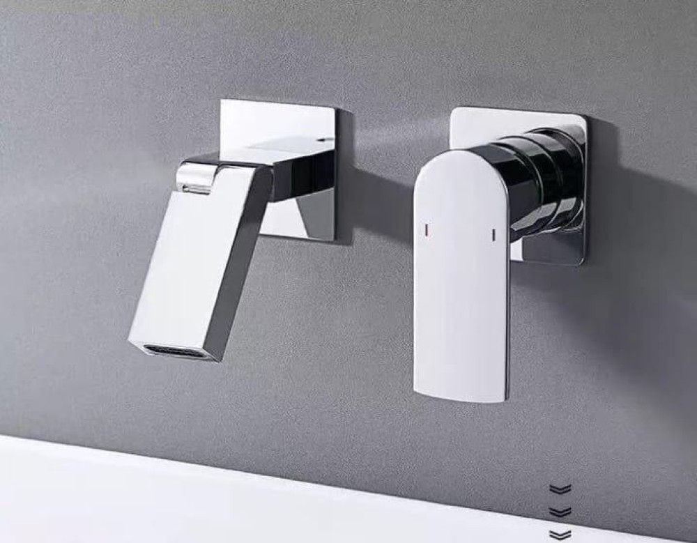 this wall-mounted bathroom basin mixer tap features a modern design with a separate faucet annd handle