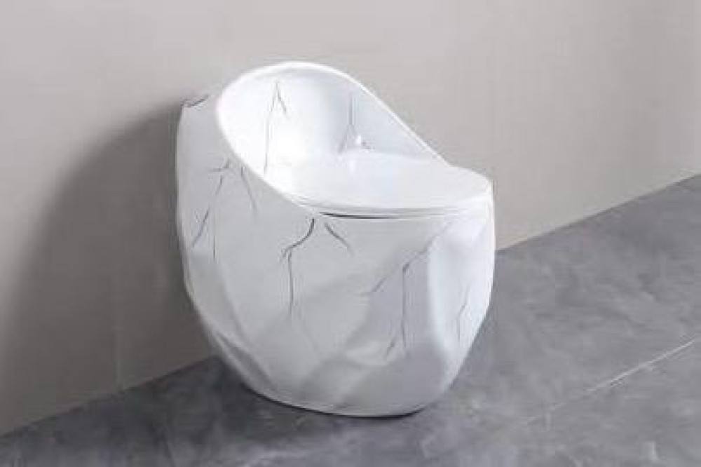 Decorative egg-shaped one-piece toilet with a unique fractured marble texture