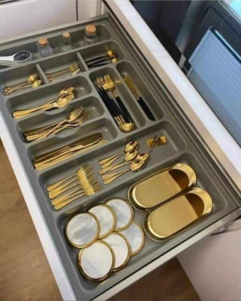 Modern Cutlery organizer with gold-plated utensils and matching dishes