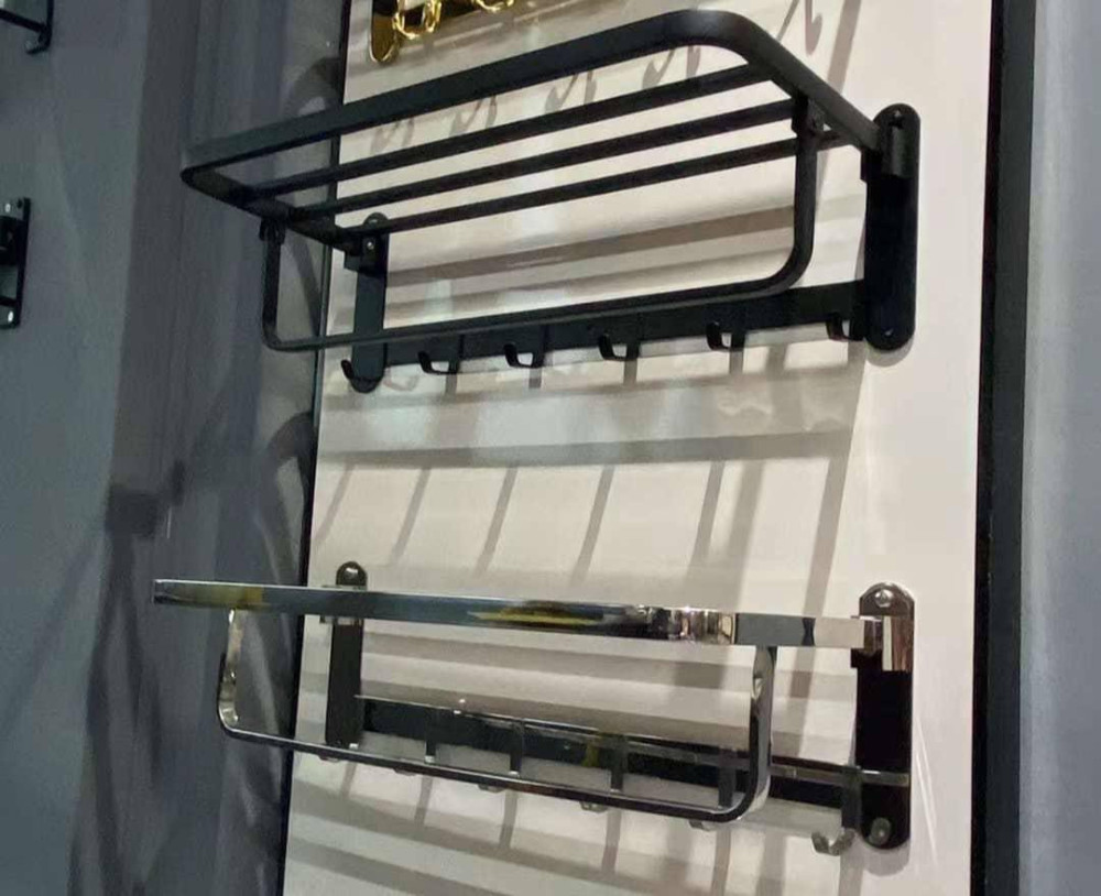 wall-mounted stainless steel bathroom towel rack featuring a folding top shelf