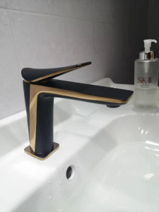 Modern black and gold single-handle basin mixer tap