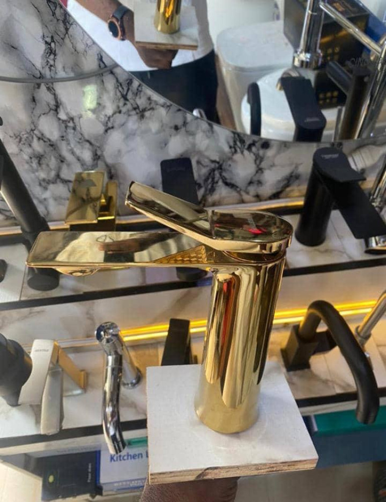gold-coloured bathroom basin mixer tap is typically constructed from brass for durability