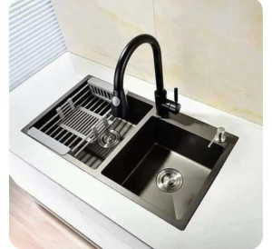 black stainless steel workstation Kitchen sink featuring a double-bowl design with a pull-out faucet