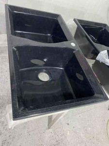 black granite Kitchen is manufactured by brands such as Tash or Generic 