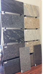 Displa rack featuring various types of granite tiles and slabs
