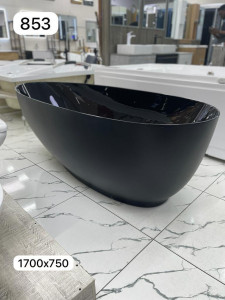 Black freestanding bathtub appears to e similar to models 