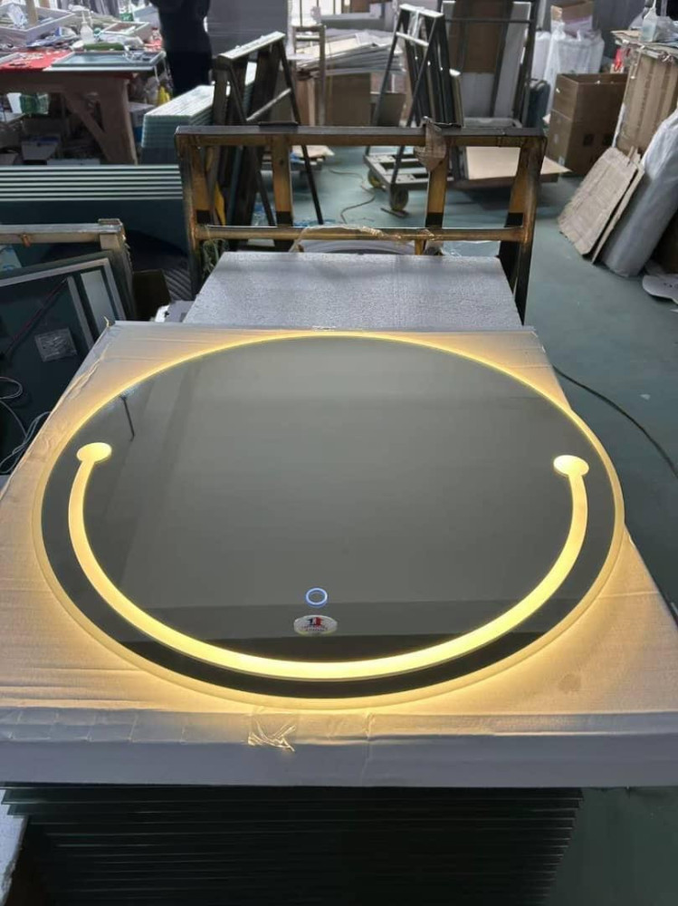 modern, round LED smart mirro typically used for bathroom vanity or makeup grooming