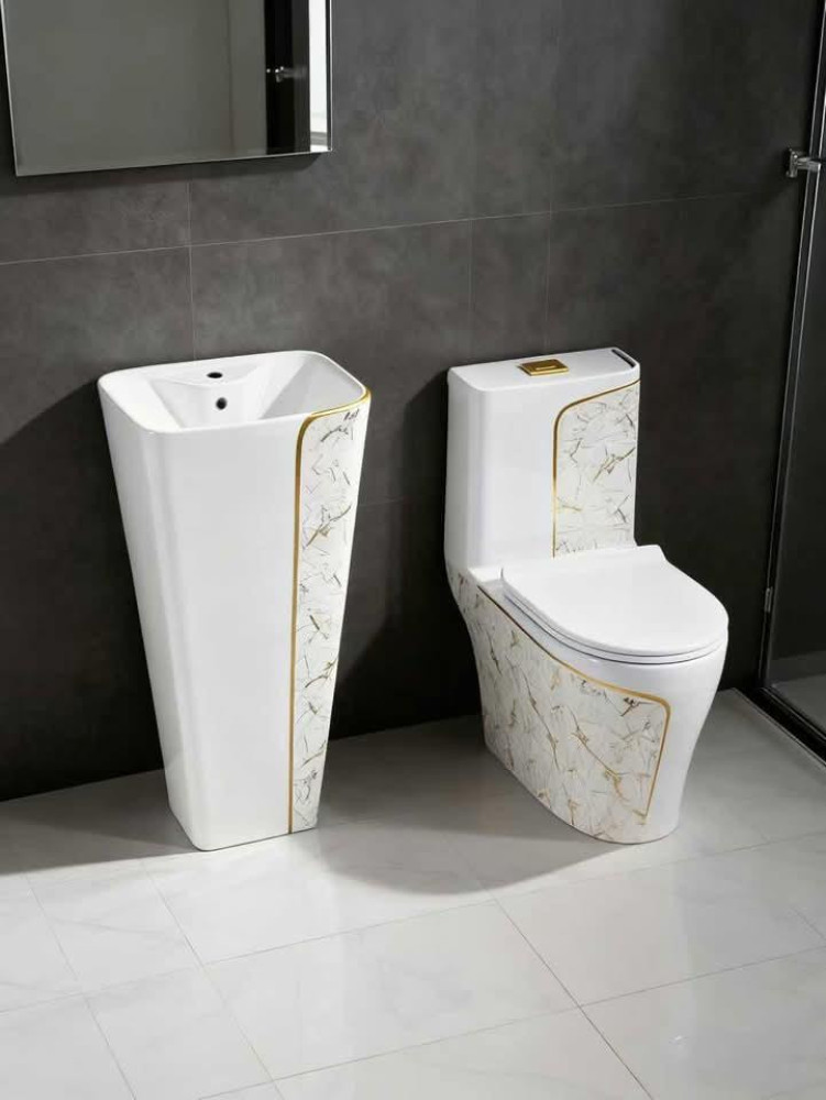 Modern Cermic bathroom set featuring a frestanding pedestal wash basin and a matching floor-mounted one-piece toilet