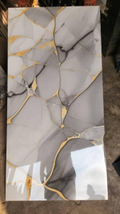 glosy porcelain or PVC marble-style wall or floor tile with gold veining 