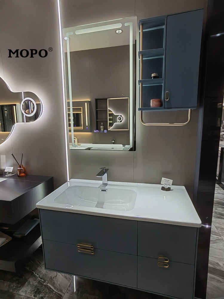 modern MOPO bathroom vanity set featuring a blue cabinet, a white cink, and a matching LED-lit mirror