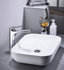 modern ceramic countertop vessel basin sink with a chrome faucet