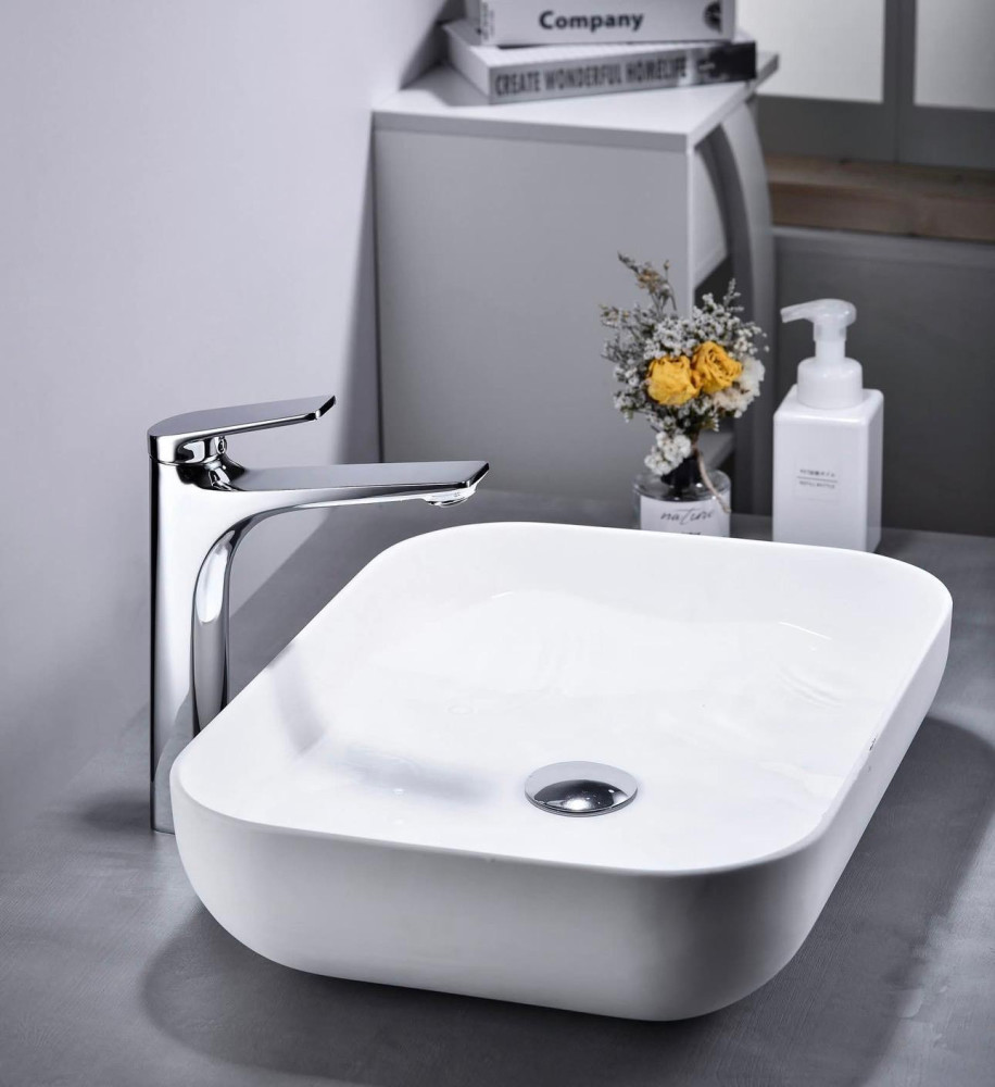modern ceramic countertop vessel basin sink with a chrome faucet